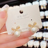 Bow Stud Earrings with Rhinestones and Acrylic Pearls