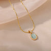 Gold Tone Oval Stone Pendant Necklace