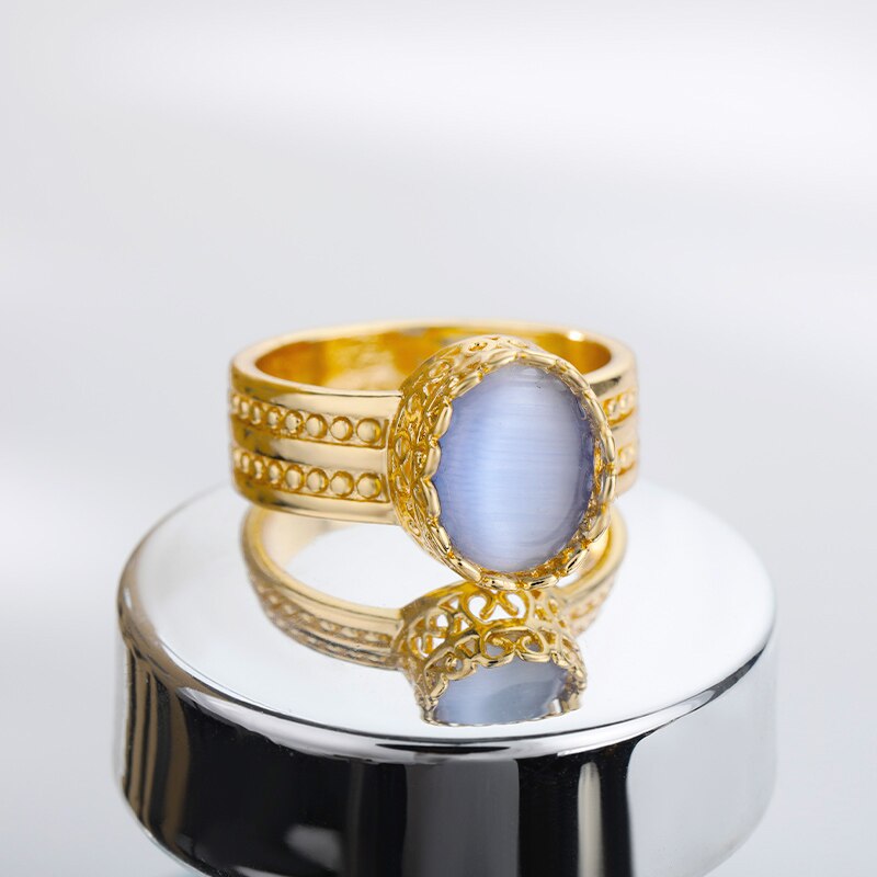 Gold ring with simulated sapphire and zircons | JewelryAndGems.eu