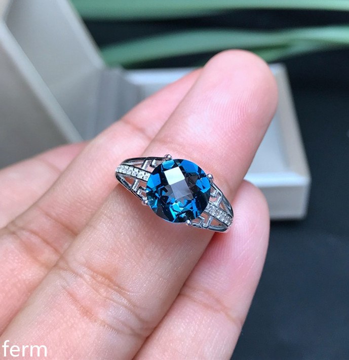 fine jewelry The 925 sterling silver is recommended for both men and women with a natural blue topaz ring that is comp