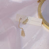 Korean design jewelry exquisite copper inlaid zircon asymmetric feather earrings elegant women's prom earrings