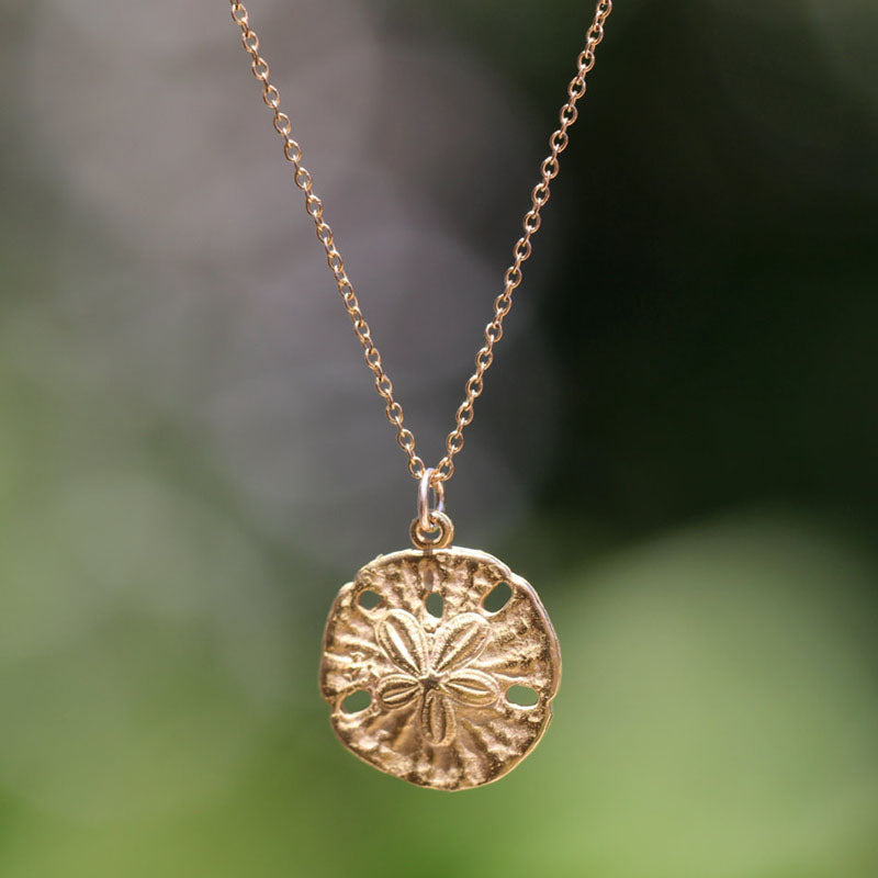 Gold sand dollar necklace - delicate necklace - gold sand dollar hanging from a KC gold XL331